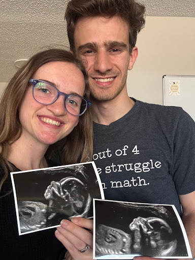 Reuben and Rebecca holding Ultrasound photos